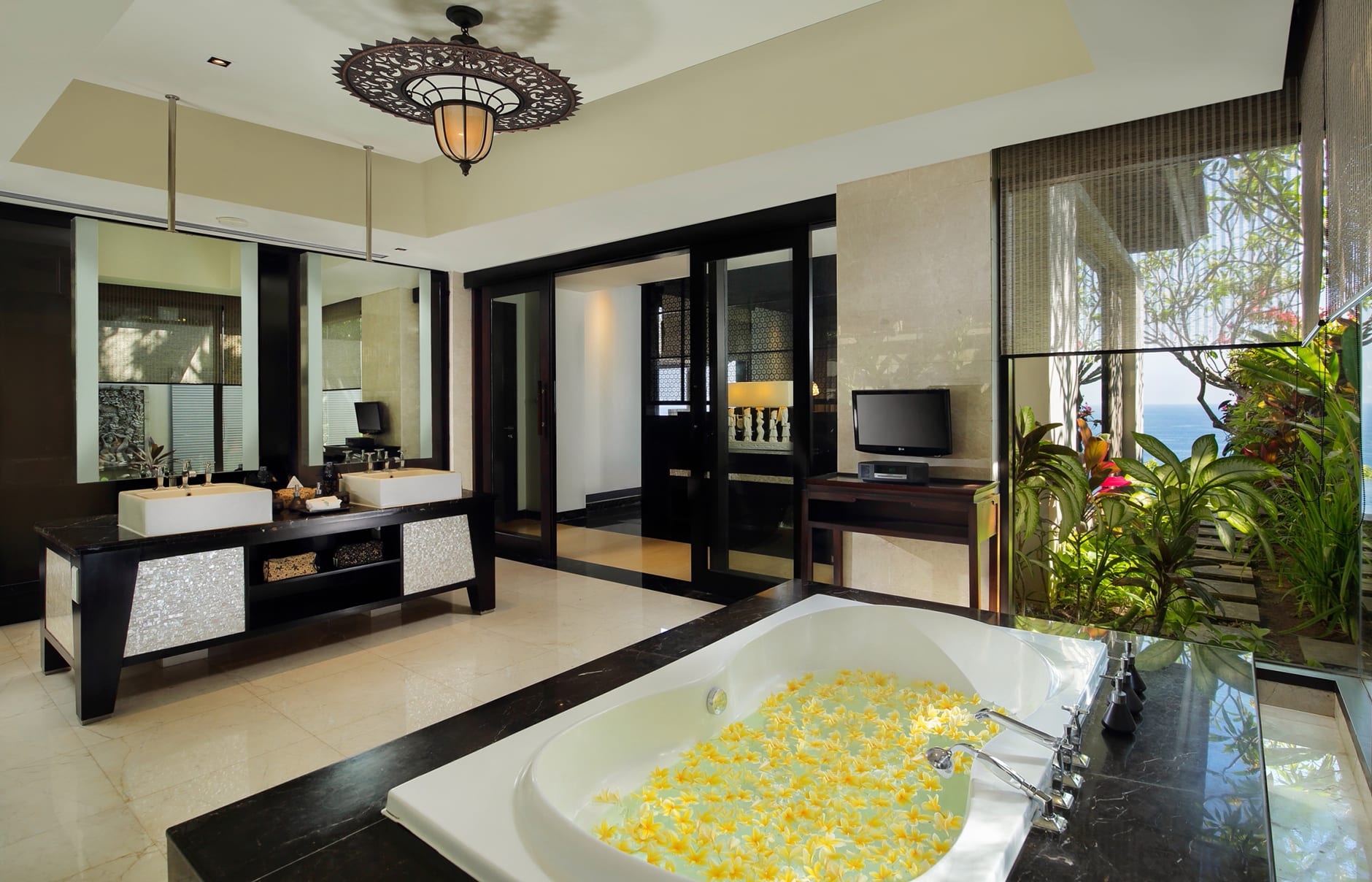 Umana Bali, LXR Hotels & Resorts, Bali, Indonesia. Hotel Review by TravelPlusStyle. Photo © Hilton 70603280-h1-pool_villa_bathroom