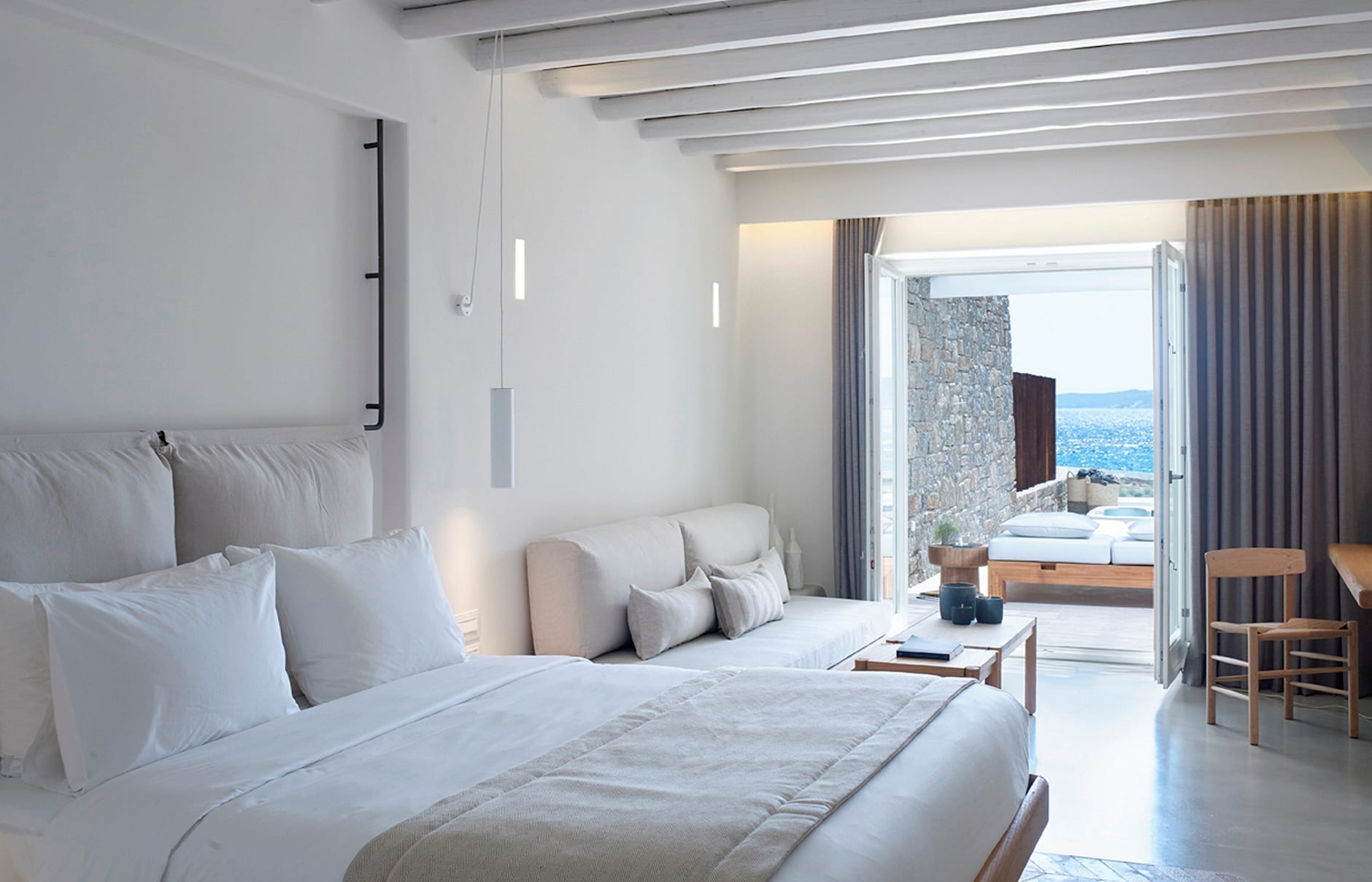 Deluxe Coast Suite. Bill & Coo Mykonos, Greece. Hotel Review by TravelPlusStyle. Photo © Bill & Coo Mykonos