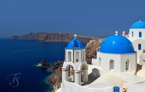 Blue domes in Oia, on the island of Santorini, Greece. © Travel+Style