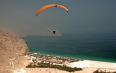 Paragliding above Zighy Bay, Oman. © TravelPlusStyle.com