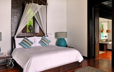 Villa Bedroom, Four Seasons Resort Koh Samui. © Travel+Style