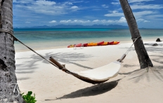 Hammock On The Beach, Four Seasons Resort Koh Samui. © Travel+Style