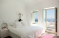 Deluxe Room. Grace Hotel Santorini, Greece. Luxury Hotel Review by TravelPlusStyle. Photo © Auberge Resorts Collection