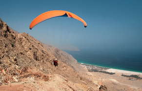 Paragliding into the Six Senses Zighy Bay, Musandam Peninsula, Oman. Photo by ©TravelPlusStyle.com