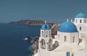 Santorini Blue Domes. The Best of Greece • Photo © TravelPlusStyle.com