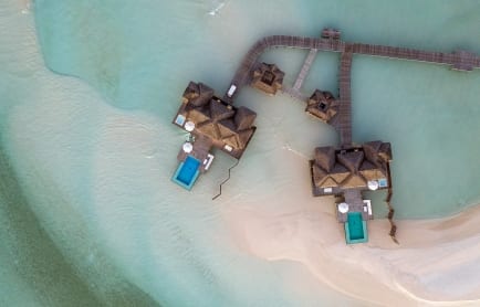 cnrd_muraka_aerial_sunset_water_villas_dusk_hr