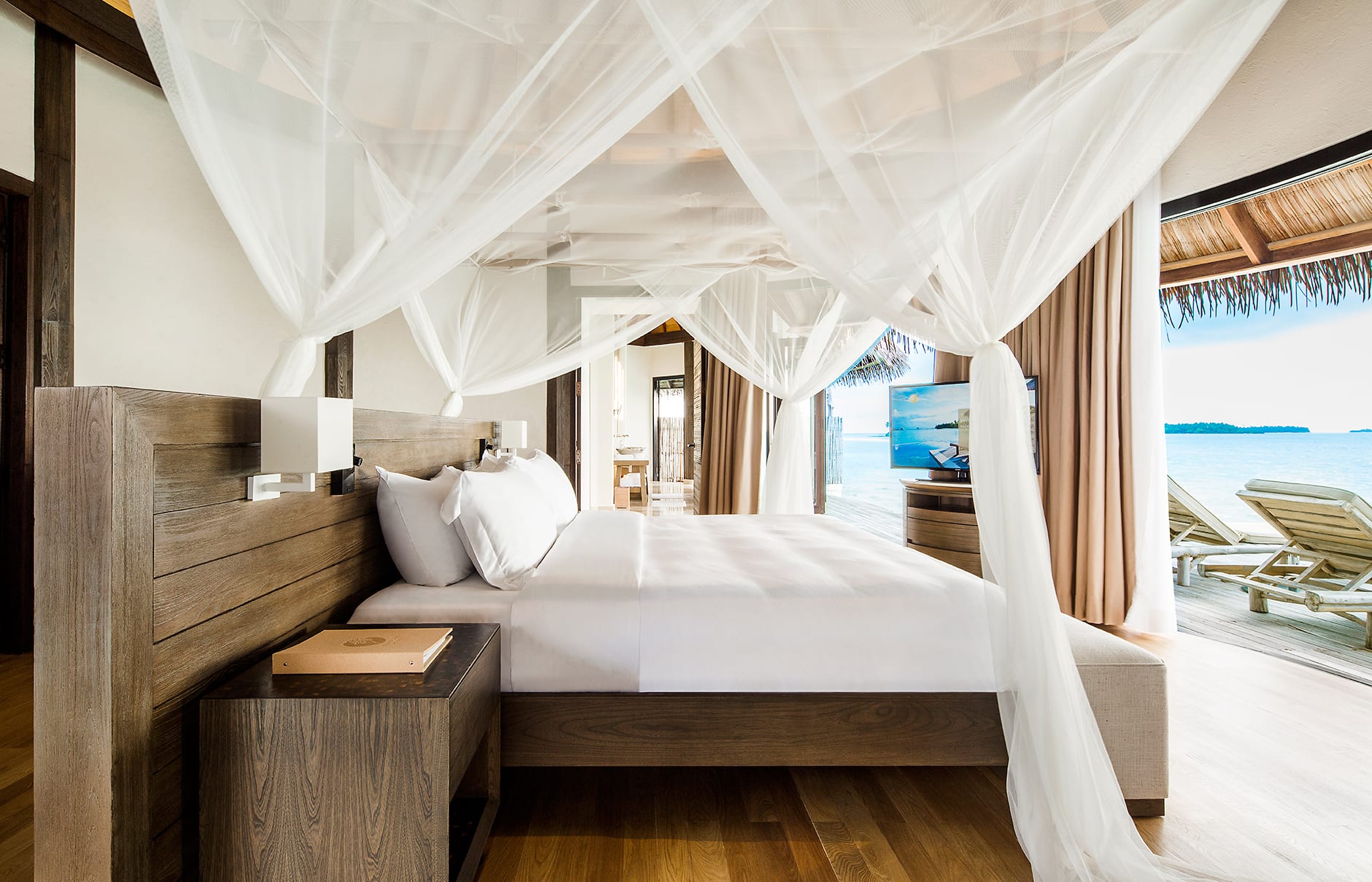 Overwater Villa bedroom. COMO Maalifushi, Maldives. Hotel Review by TravelPlusStyle. Photo © COMO Hotels & Resorts