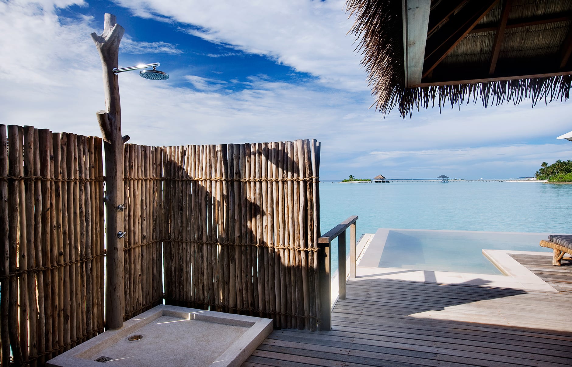 Water Villa outdoor shower. COMO Maalifushi, Maldives. Hotel Review by TravelPlusStyle. Photo © COMO Hotels & Resorts