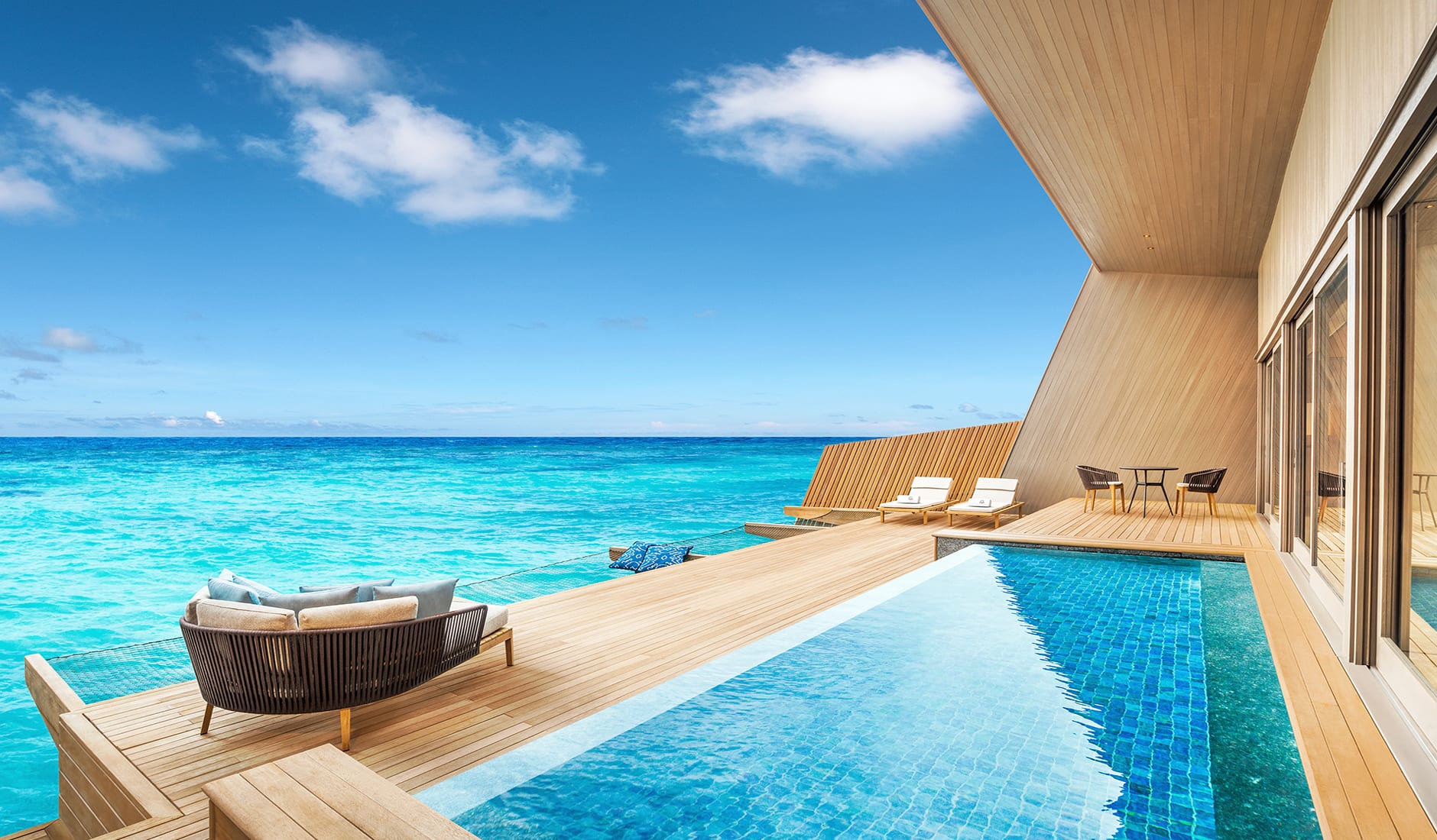 St. Regis Maldives Vommuli Resort, Dhaalu Atoll, Maldives. The Best Luxury Resorts in the Maldives by TravelPlusStyle.com stregis-vommuli-overwater-villa-with-pool-deck-travelplusstyle