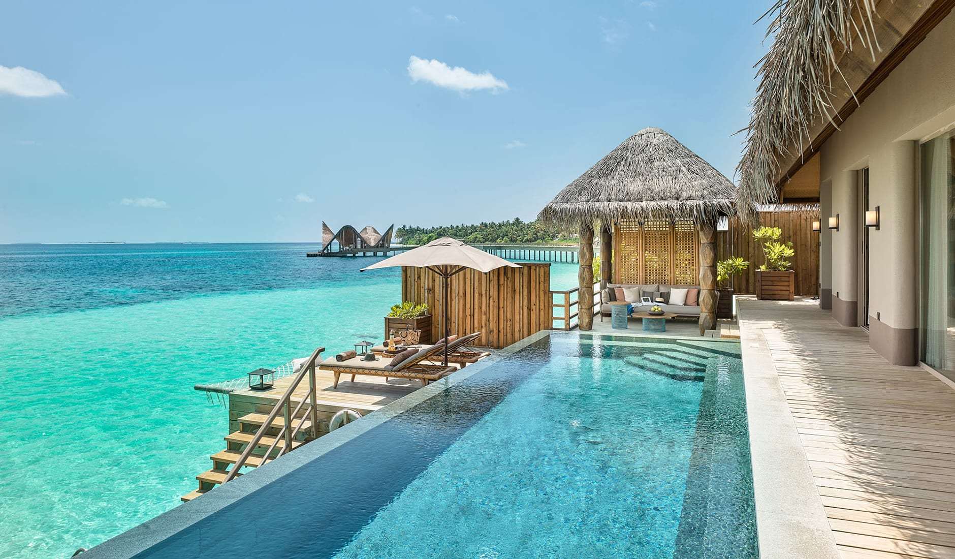 JOALI Maldives, Raa Atoll, Maldives. The Best Luxury Resorts in the Maldives by TravelPlusStyle.com sunset-watervilla-pool-outdoor-travelplusstyle