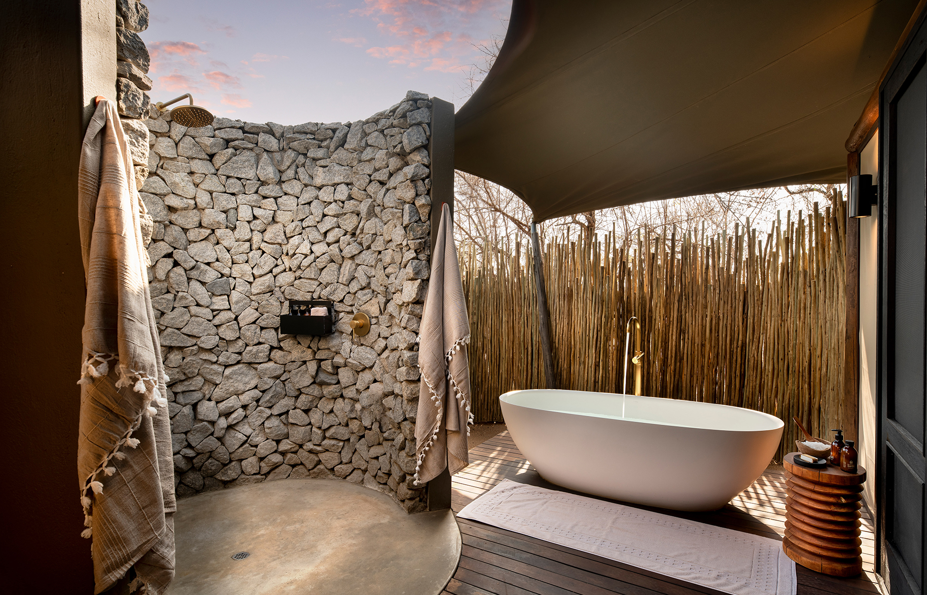 andBeyond Ngala Tented Camp, Kruger National Park, South Africa. Review by TravelPlusStyle. Photo © andBeyond South-Africa-Ngala-Tented-Camp-bathroom-al-fresco-bath-and-outdoor-shower-2