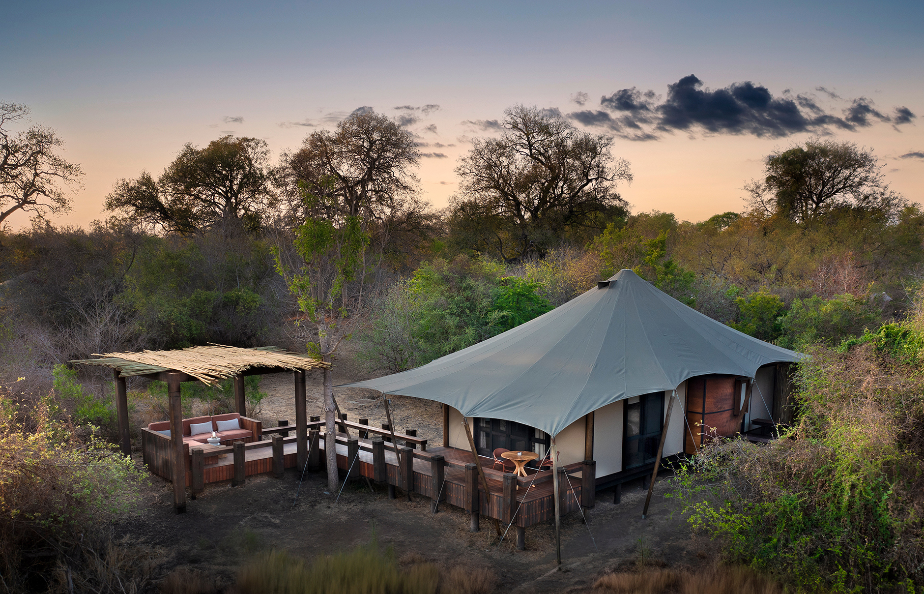 andBeyond Ngala Tented Camp, Kruger National Park, South Africa. Review by TravelPlusStyle. Photo © andBeyond South-Africa-Ngala-Tented-Camp-tented-suite-exterior-with-outside-deck