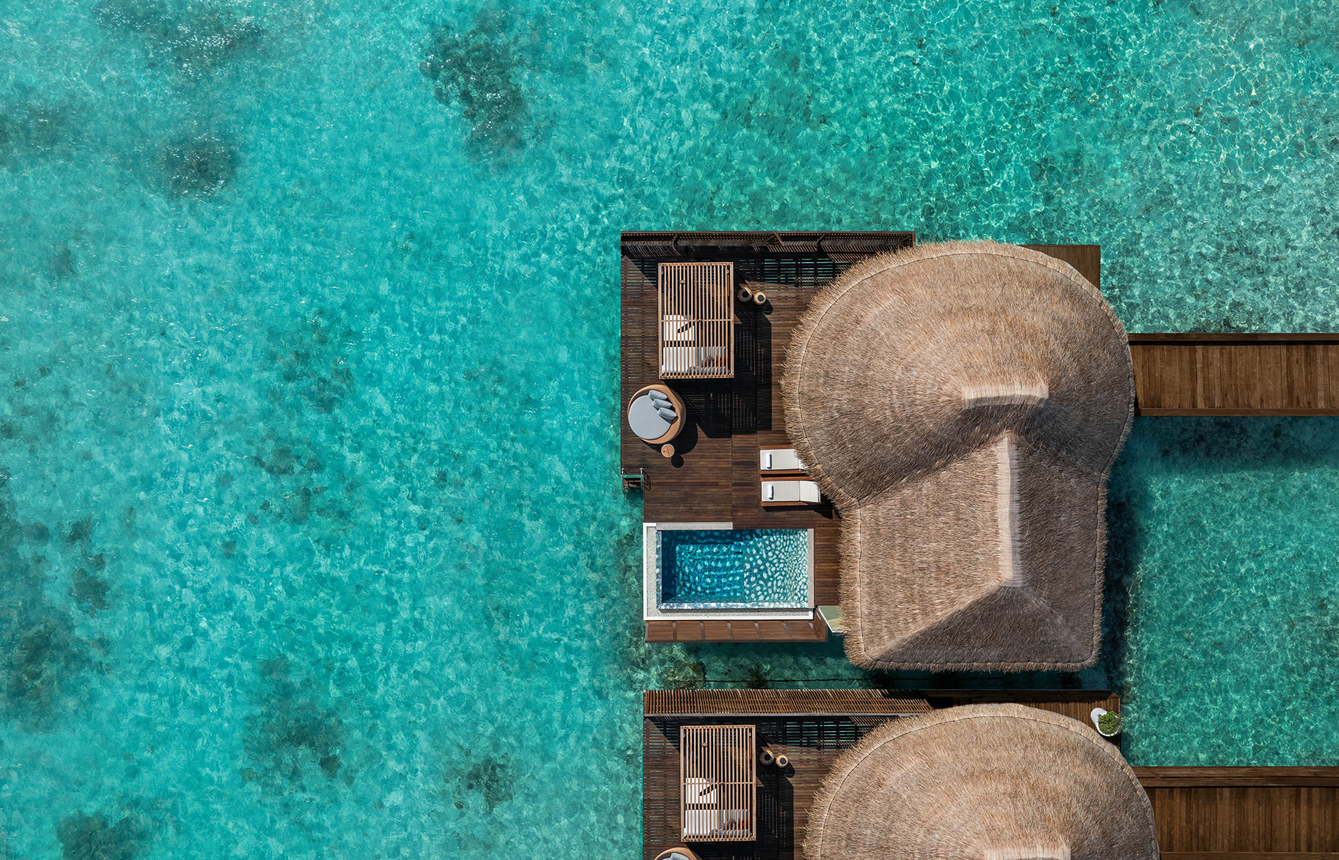 W Maldives, Fesdu Island, Maldives. Hotel Review by TravelPlusStyle. Photo © Marriott International W-Maldives-Premier-Overwater-One-Bedroom-Villa-Aerial