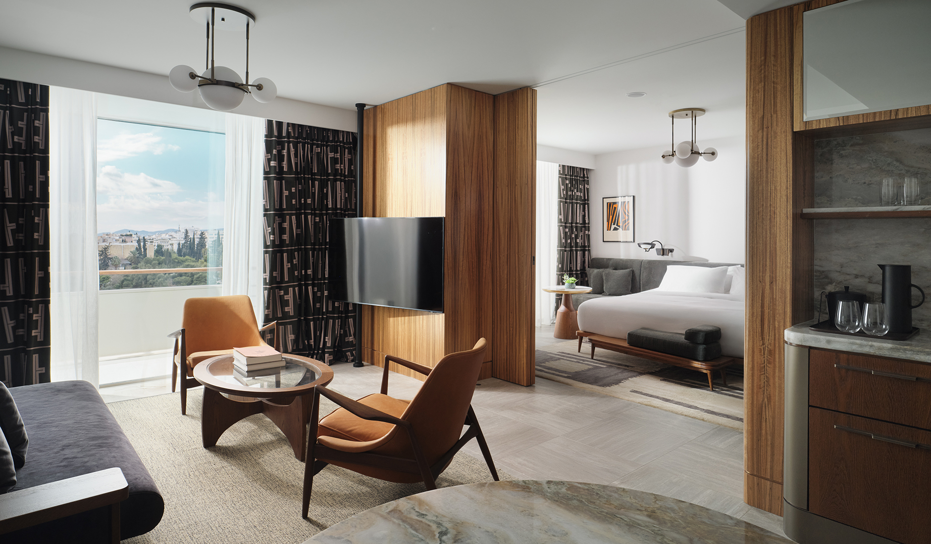 Contemporary guest room at Conrad Athens The Ilisian in Athens, featuring elegant furnishings, a neutral colour palette and floor-to-ceiling windows