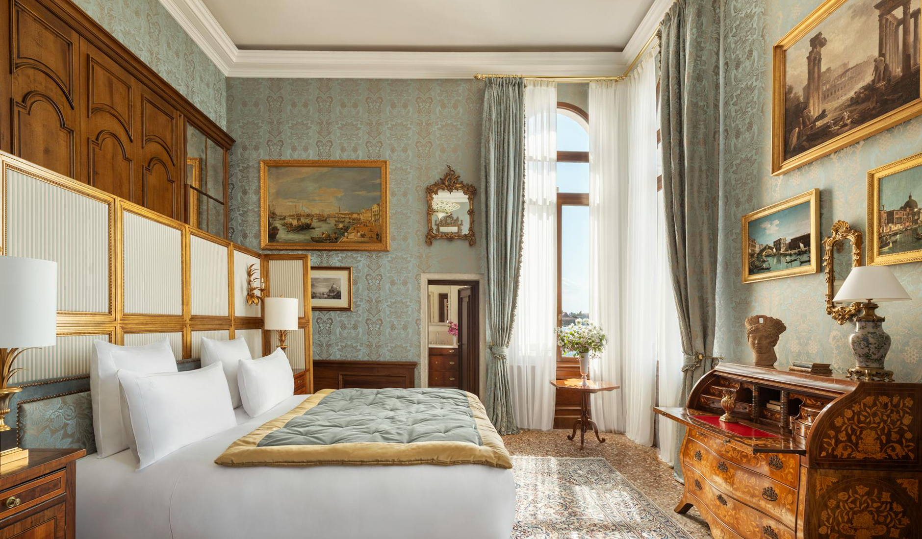 Bedroom in a luxury suite at Airelles Palladio Venezia with traditional decorative details