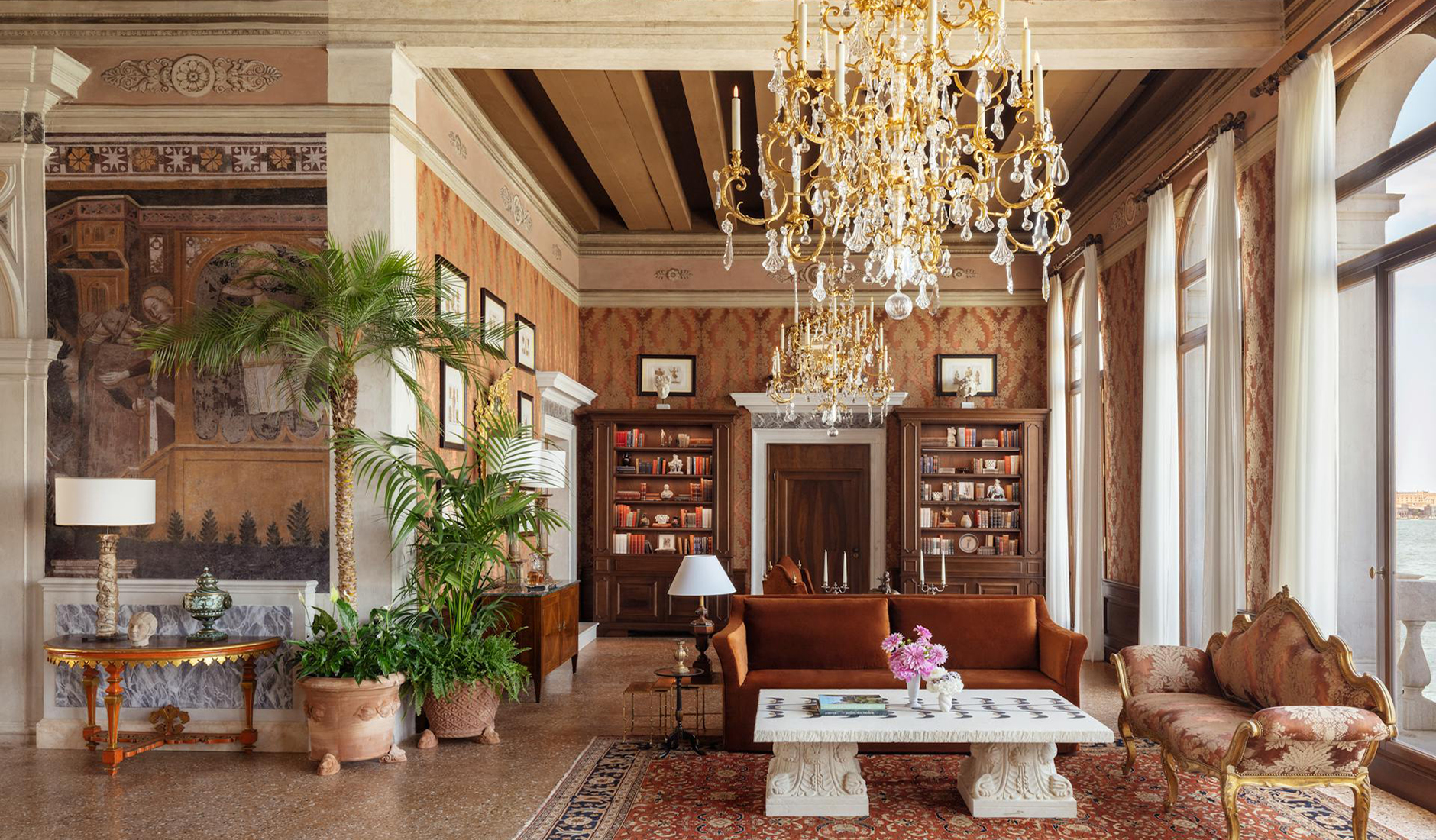 Living room in a suite at Airelles Palladio Venezia with antique furniture and carefully curated décor