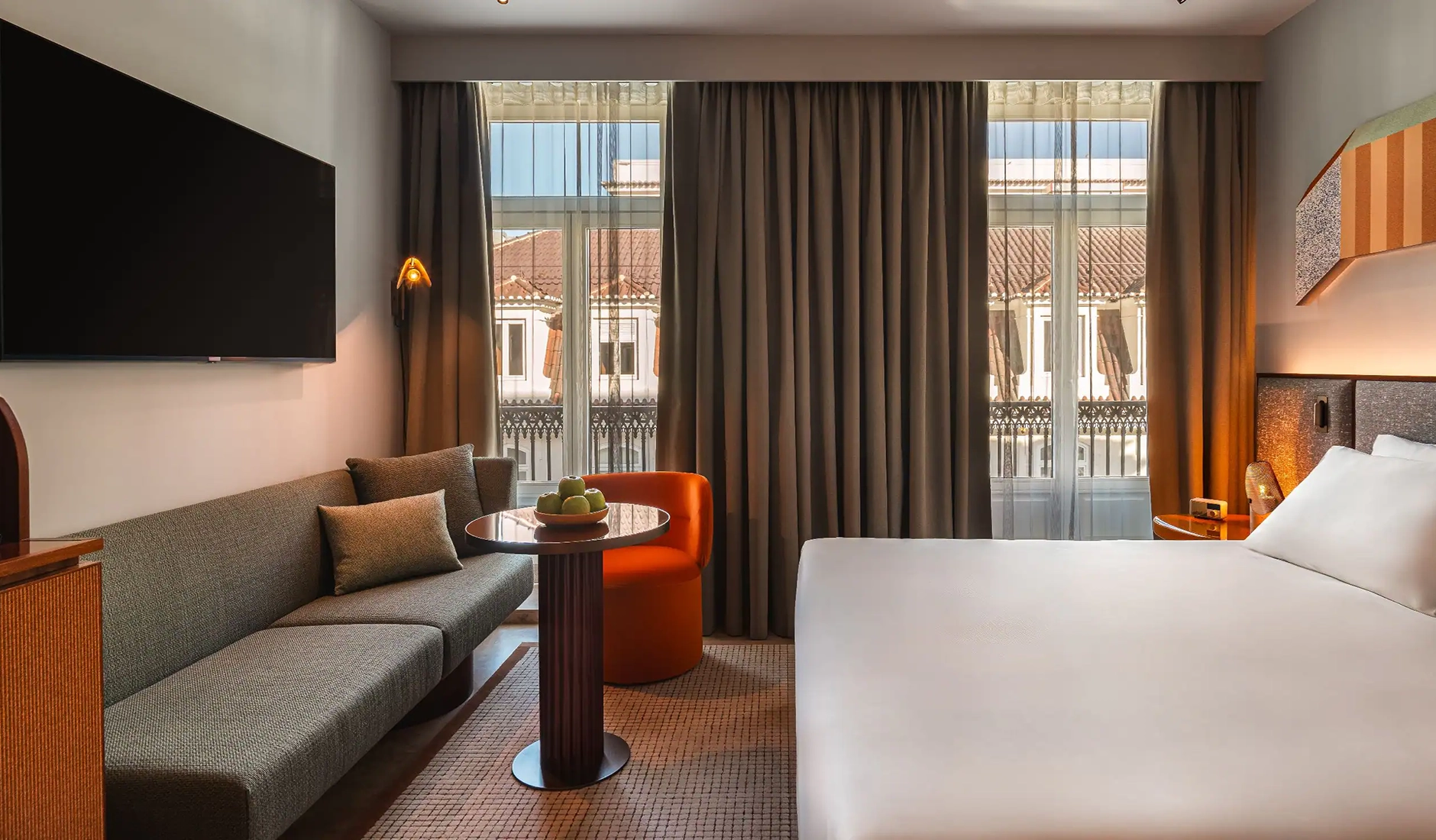 Guest bedroom at Andaz Lisbon with views across the surrounding cityscape
