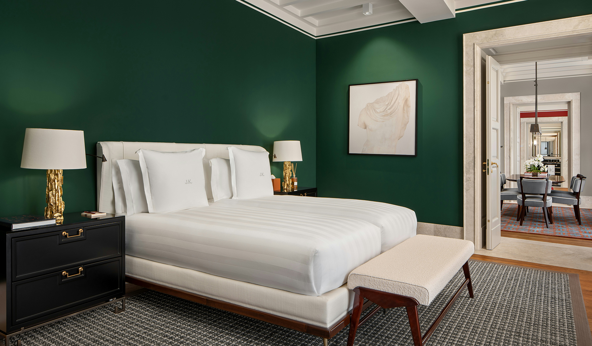 Bedroom at Casa J.K. Place Roma with tailored furnishings and a distinctive Roman-inspired colour palette