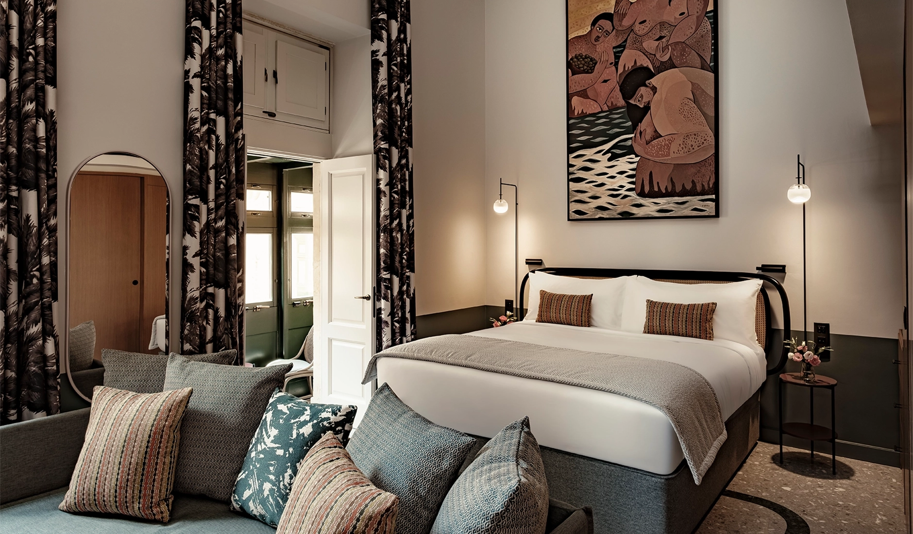 Opulent bedroom area of a luxury suite at Romègas, ranked among the best luxury hotels in Malta, showcasing high-end contemporary design blended with 16th-century historic palazzo details.