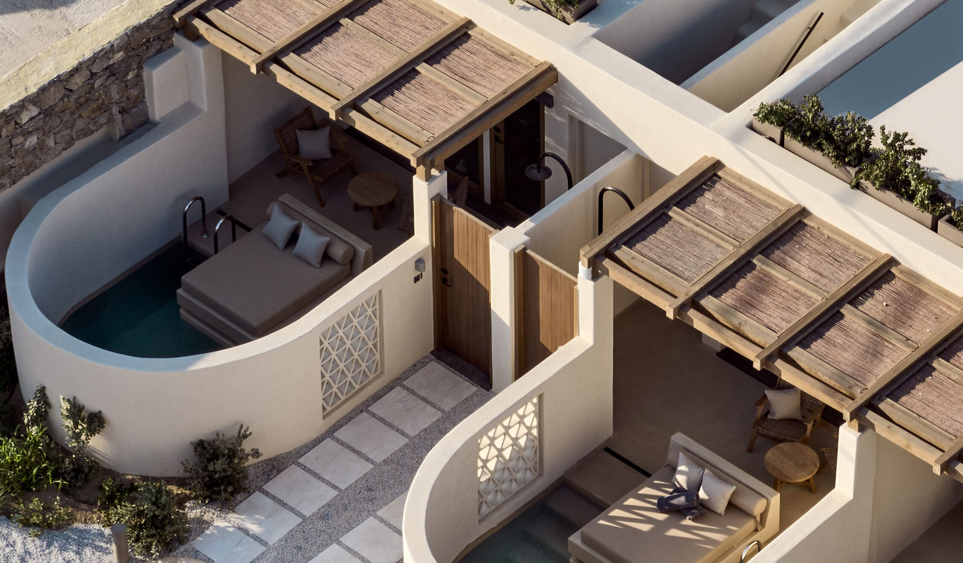 Premium suite with a private plunge pool at Omeon Mykonos, highlighted by Condé Nast Traveller as one of the best hotel accommodations on the island.