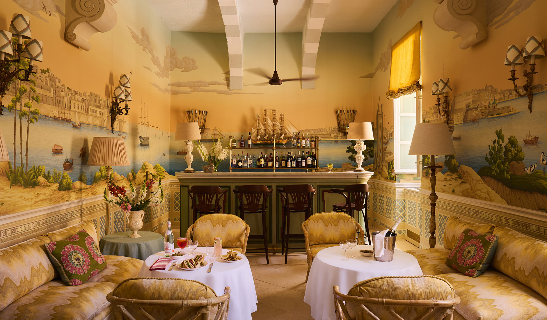 Hand-painted wallpaper and intimate interiors at the Valletta Bar in Casa Bonavita, Malta.