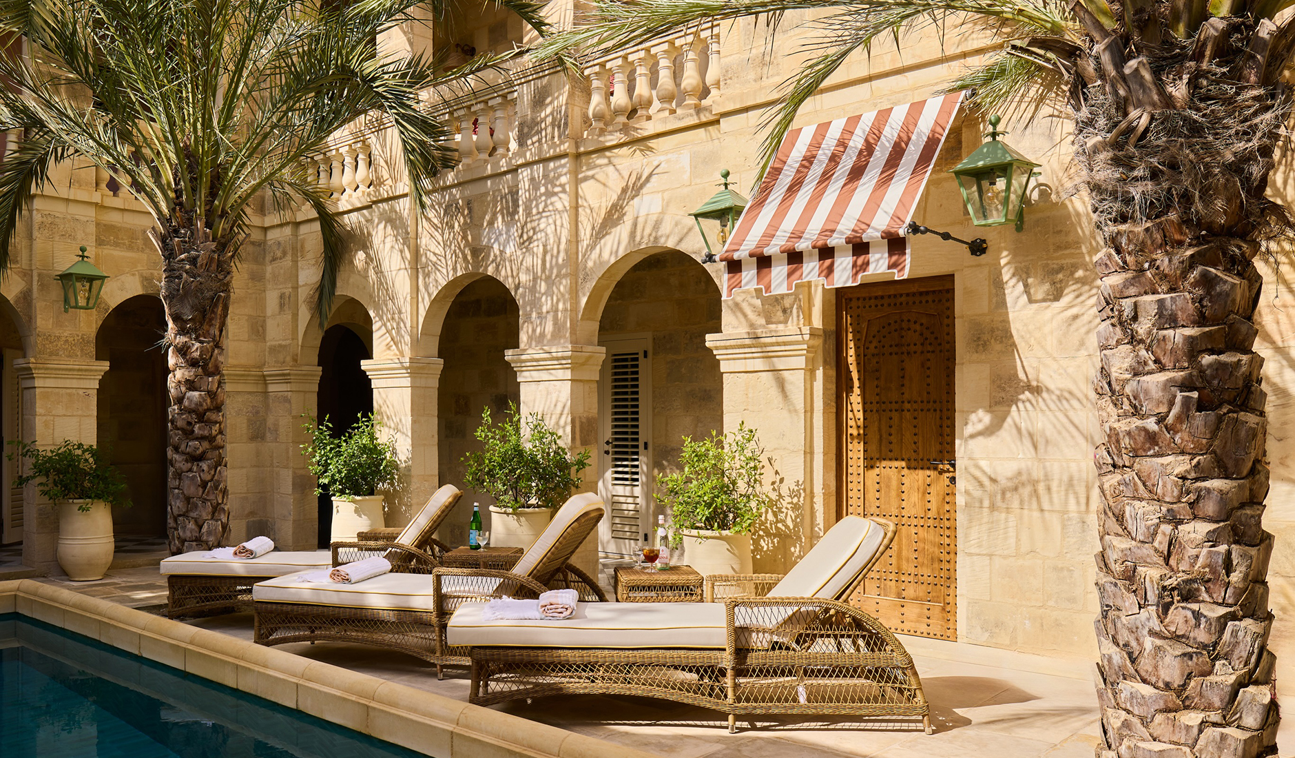 Historic façade and landscaped garden at Casa Bonavita boutique hotel in Attard, Malta.