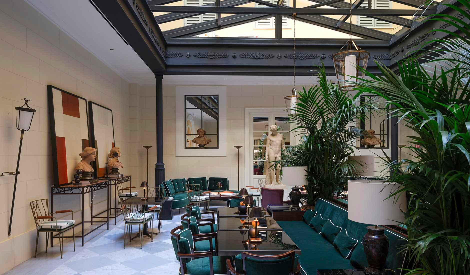 Restaurant at Casa J.K. Place Roma beneath a glass-domed courtyard roof