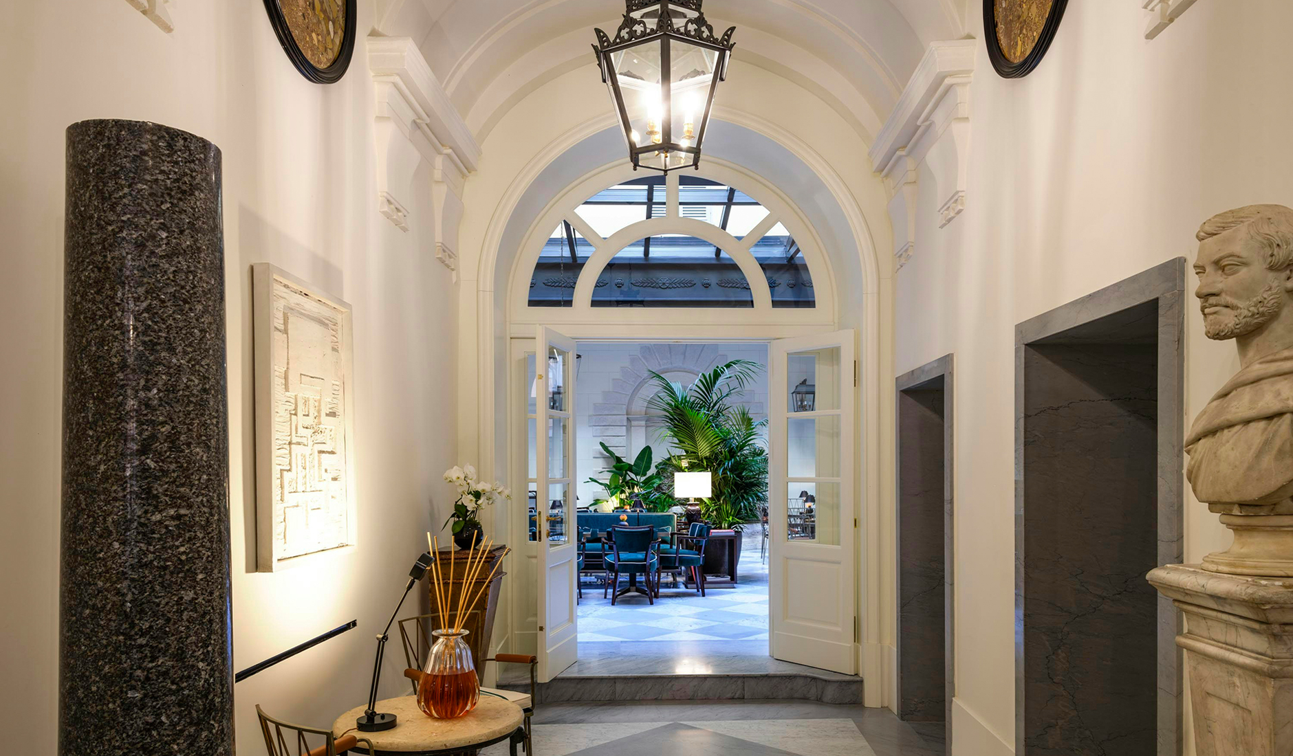 Inner courtyard at Casa J.K. Place Roma, set within the historic palazzo