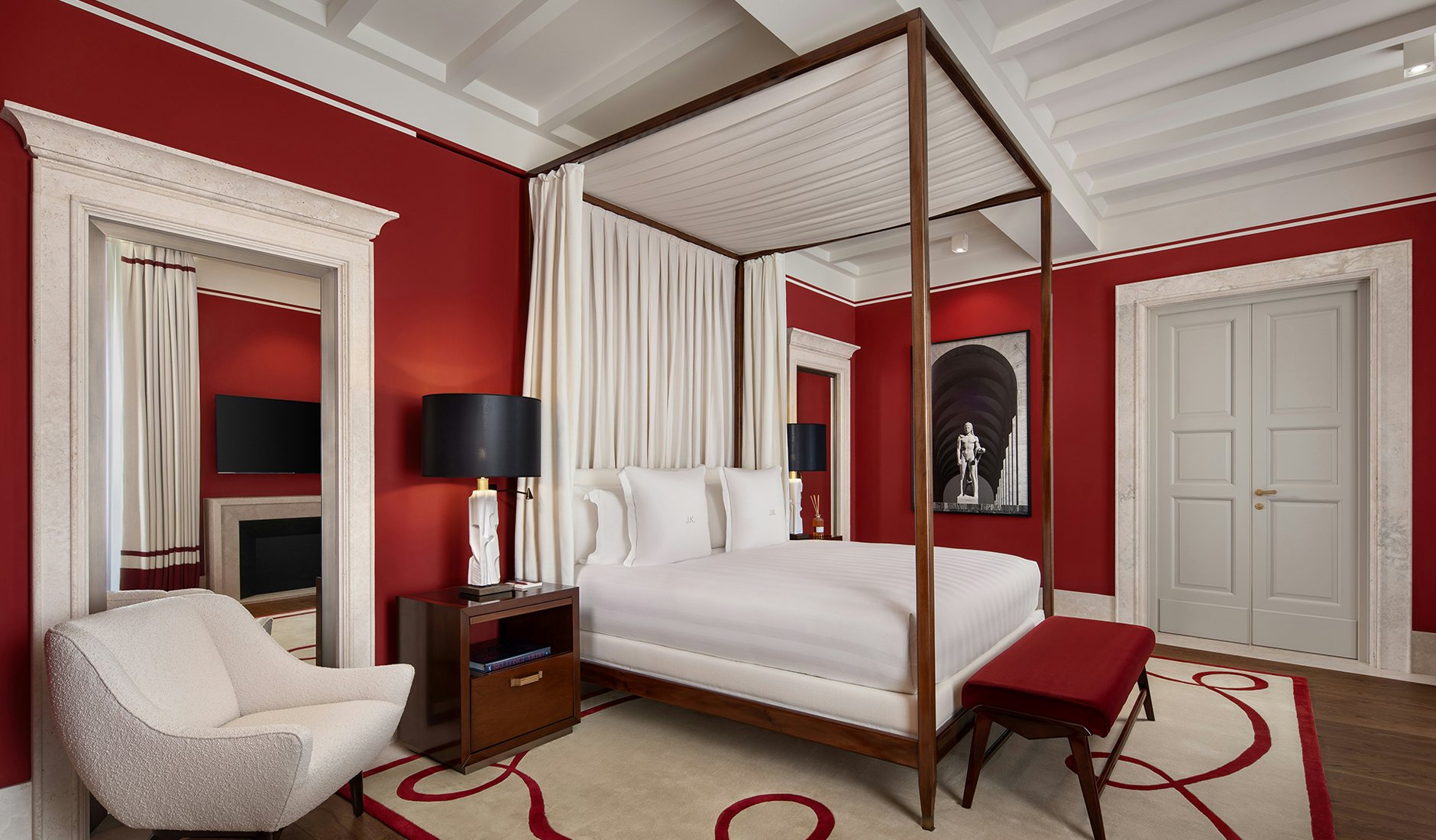 Bedroom in a luxury residence at Casa J.K. Place Roma, designed by Michele Bönan