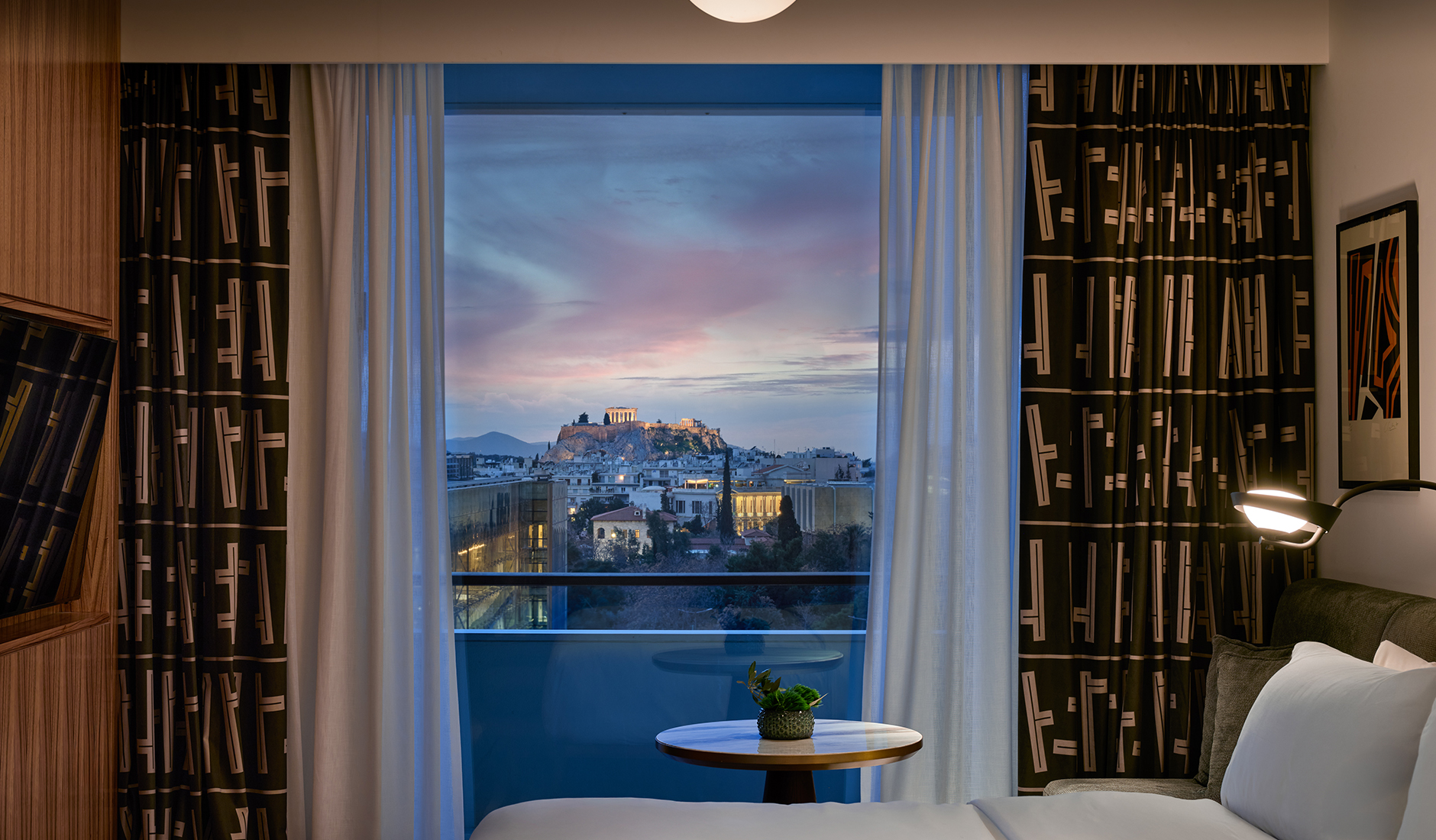 Guest room at Conrad Athens The Ilisian with views towards the Acropolis and the historic centre of Athens