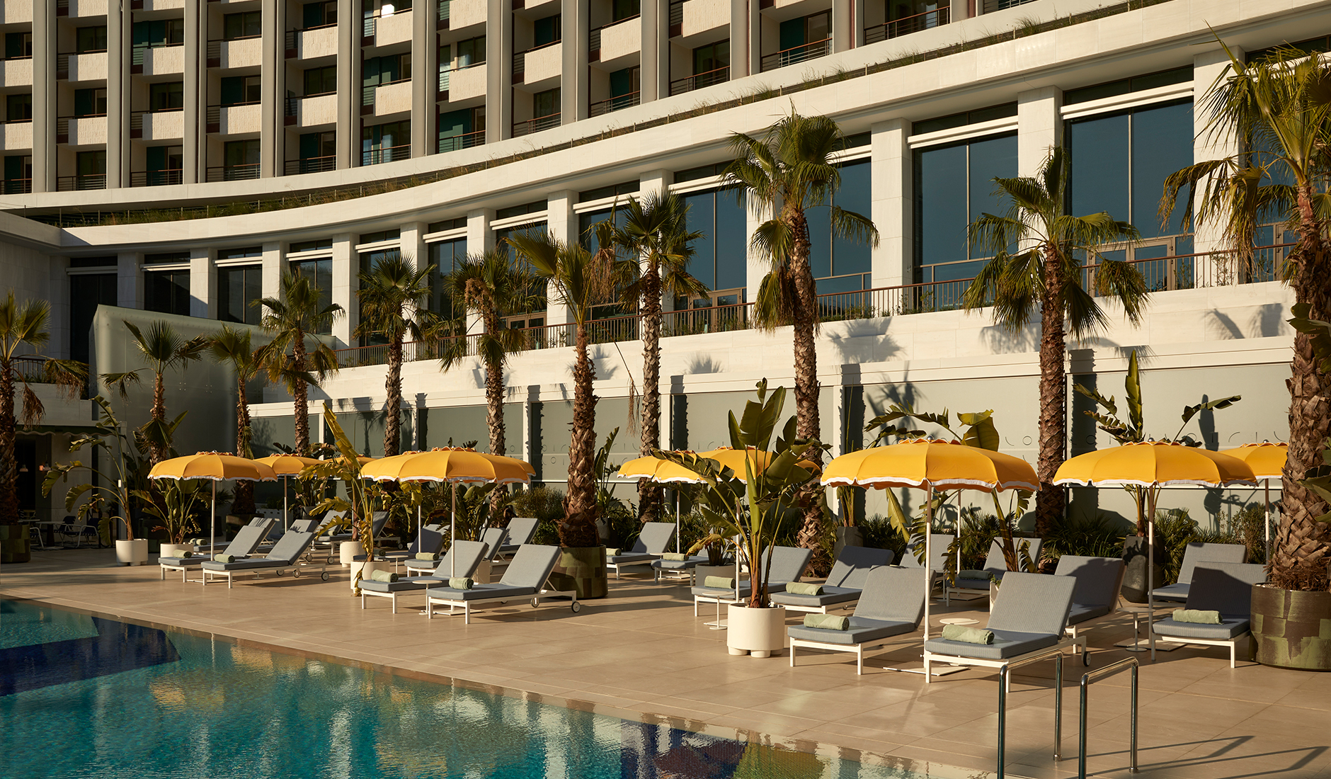 Outdoor swimming pool at Conrad Athens The Ilisian, offering a resort-style escape in the heart of the Greek capital