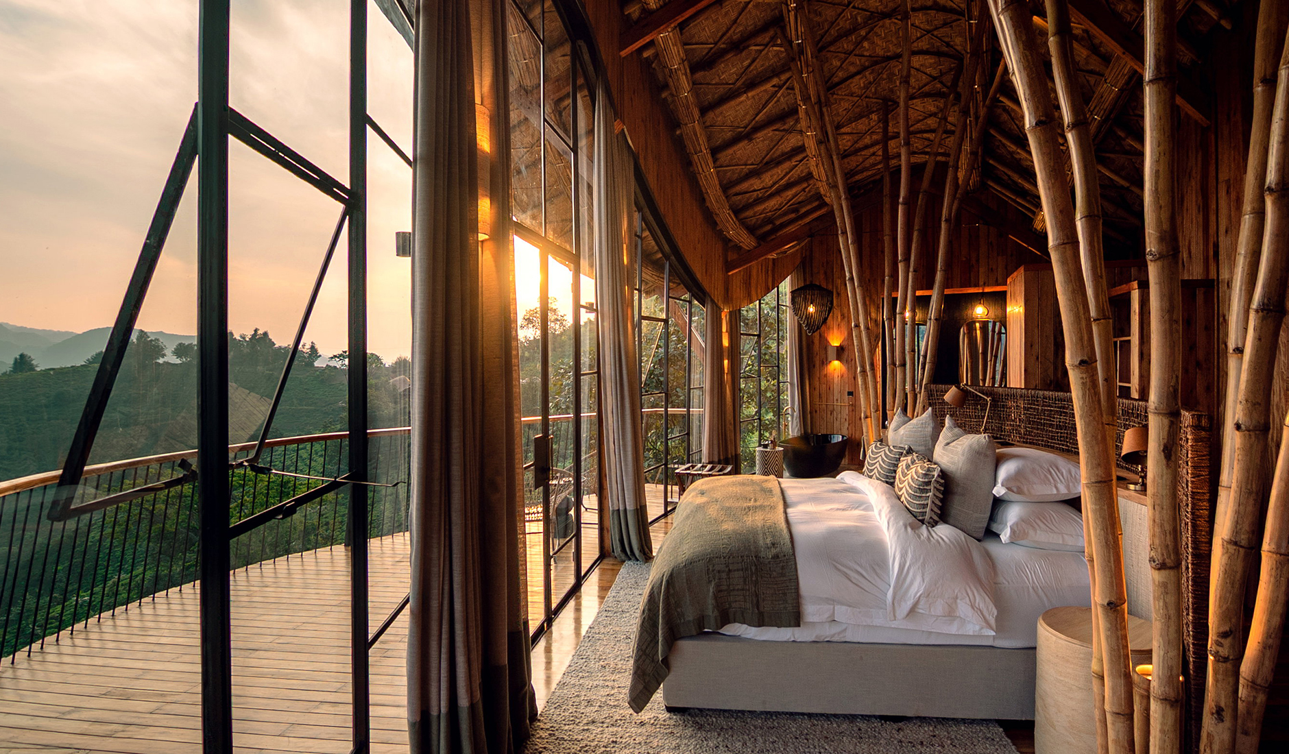 King bedroom at Erebero Hills with warm bamboo detailing and floor-to-ceiling windows