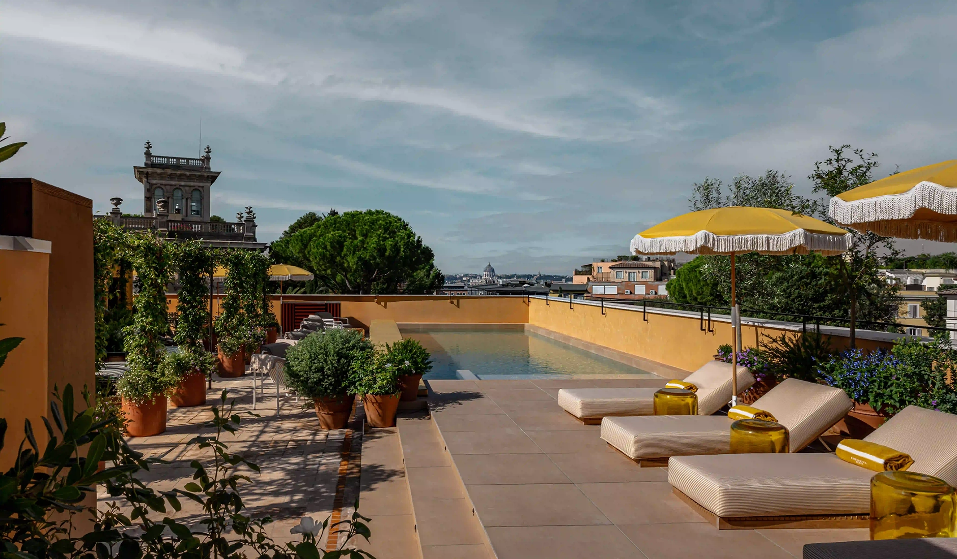 Rooftop pool at Experimental Roma with views across the rooftops of the Italian capital