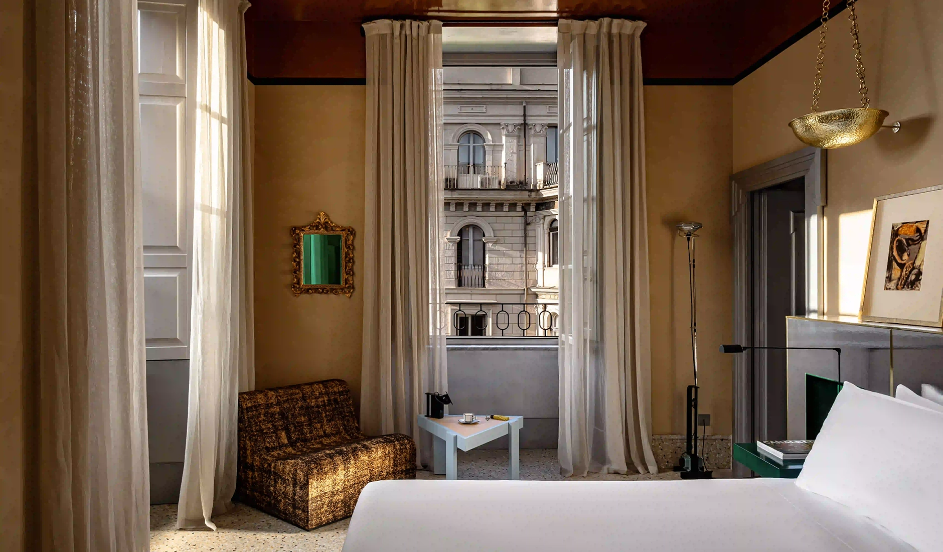 Veneto View Deluxe Room at Experimental Roma with windows overlooking Rome's rooftops