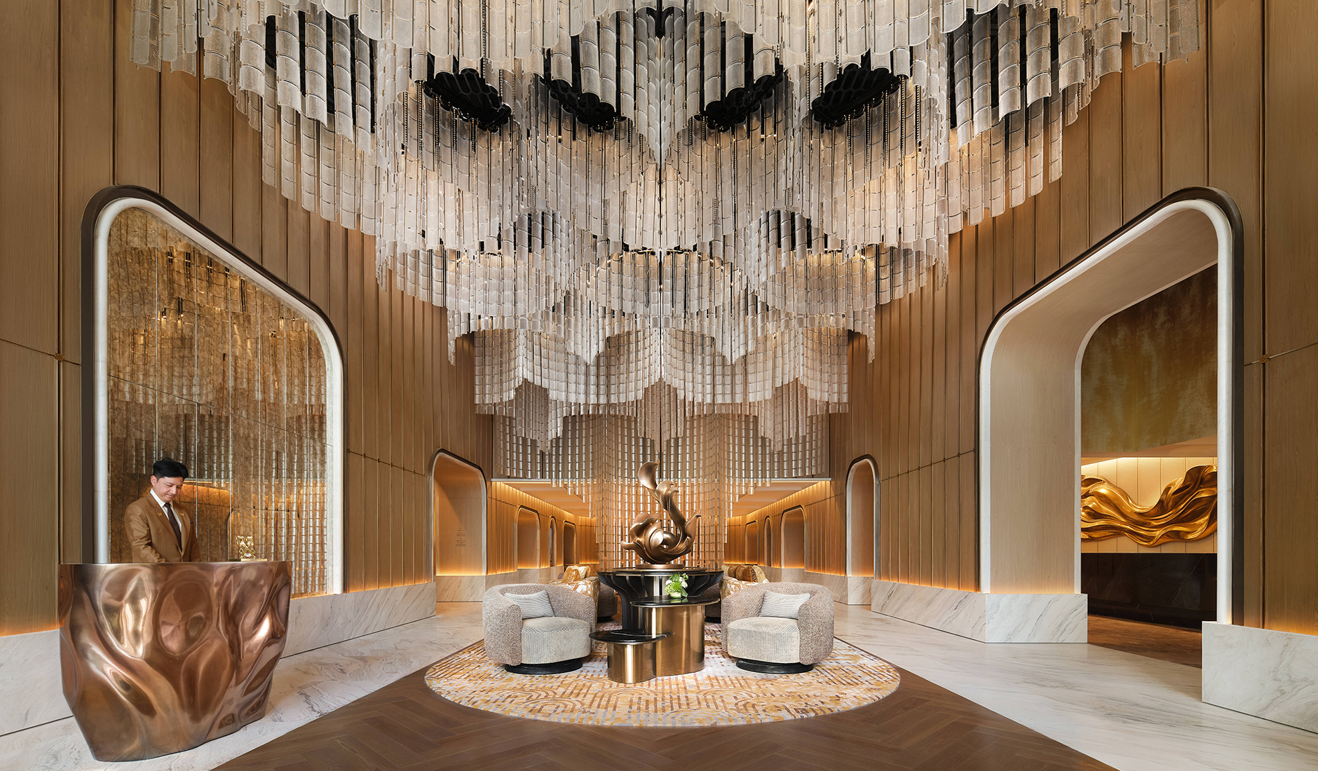 Sculptural lobby chandelier at Fairmont Bangkok Sukhumvit inspired by Thailand's golden ratchaphruek blossom