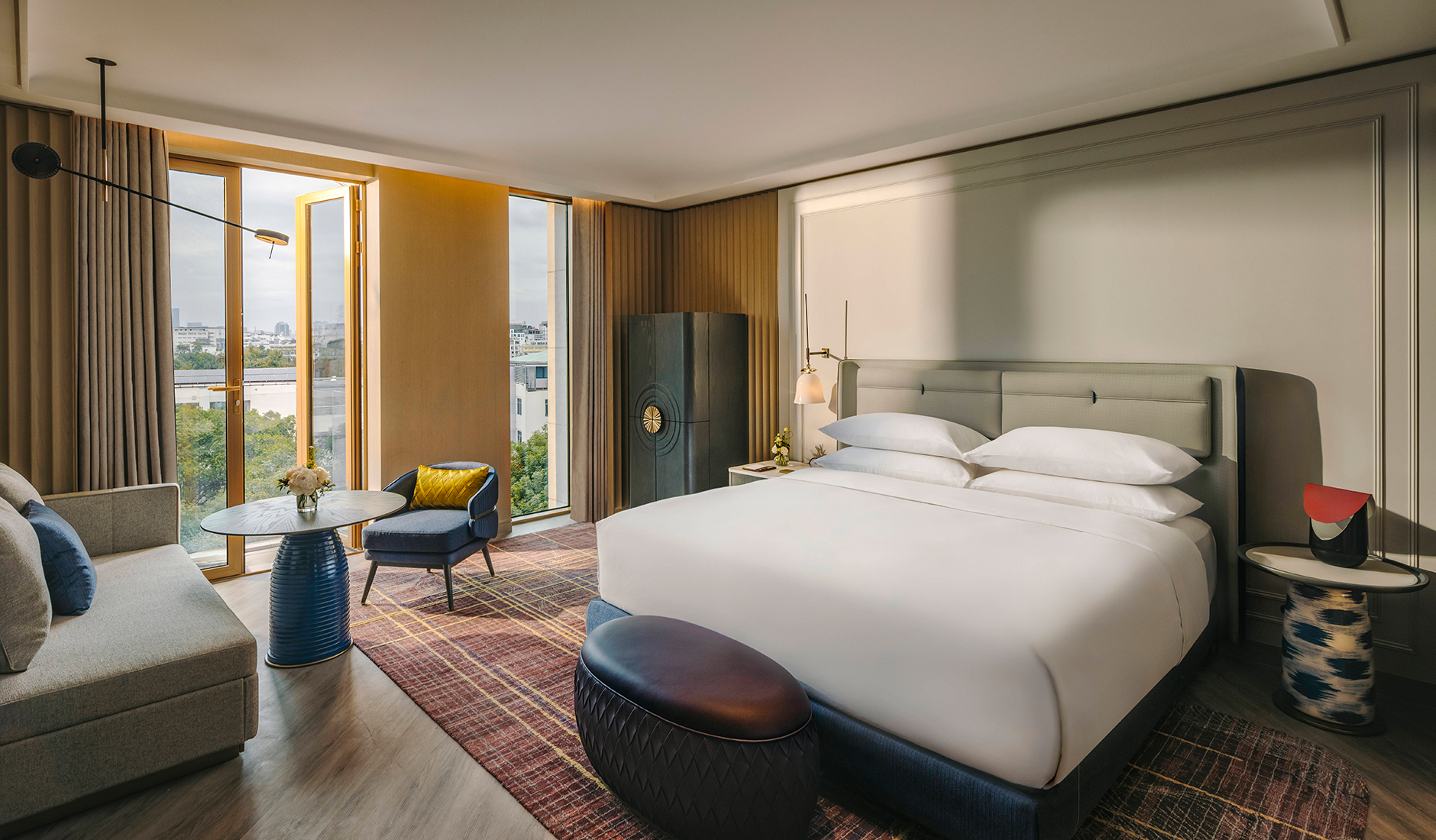 Guest room at Fairmont Hanoi overlooking the Hanoi cityscape