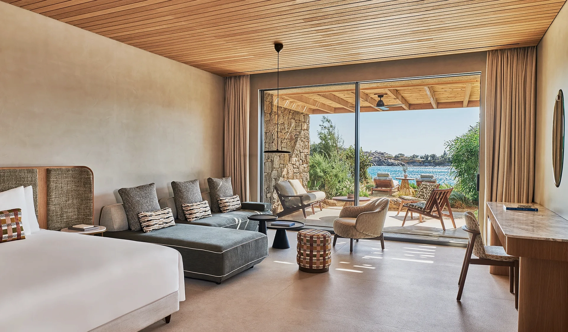 Contemporary Cycladic design and natural materials inside a luxury suite at Fouquet’s Mykonos.