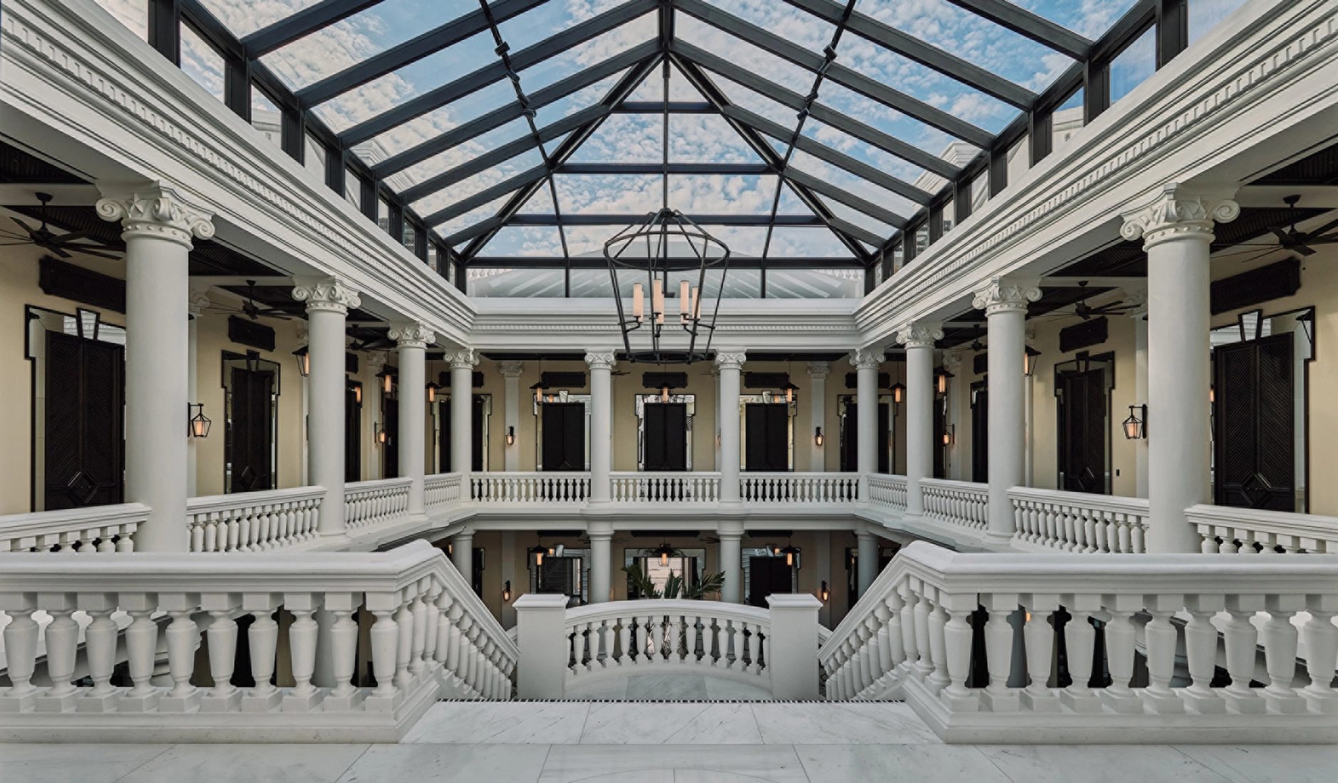 Glass-roofed atrium at Four Seasons Hotel and Residences Cartagena, bringing natural light into the historic building