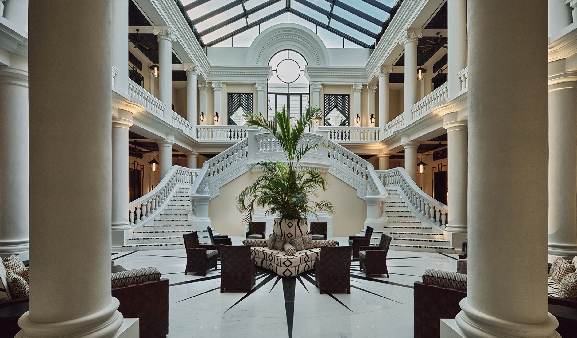 Grand staircase beneath the glass atrium at Four Seasons Hotel and Residences Cartagena