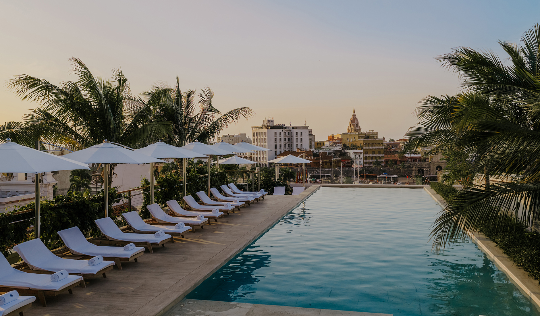 Rooftop swimming pool at Four Seasons Hotel and Residences Cartagena overlooking the city