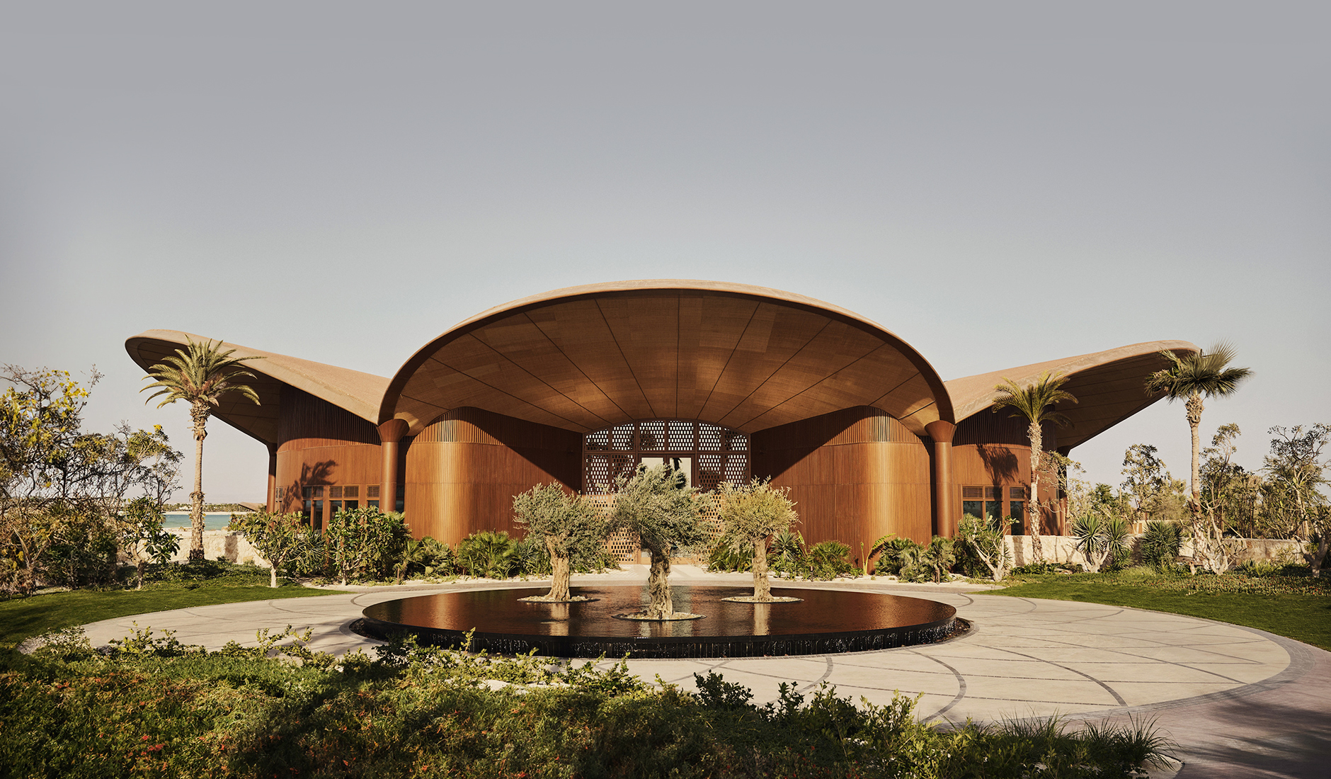 Dramatic exterior view of the spectacular main pavilion building at Four Seasons Resort and Residences Red Sea at Shura Island, showcasing its iconic organic architecture.