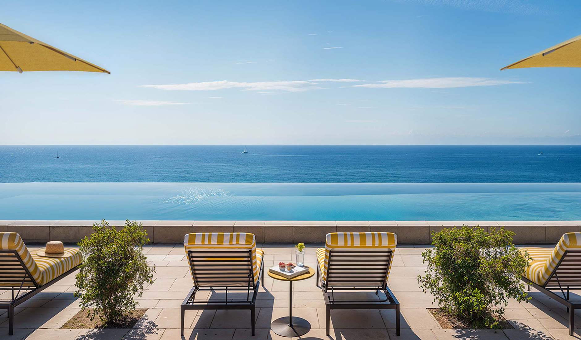 Swimming pool at Gran Hotel Margalida overlooking the Mediterranean coast of Mallorca