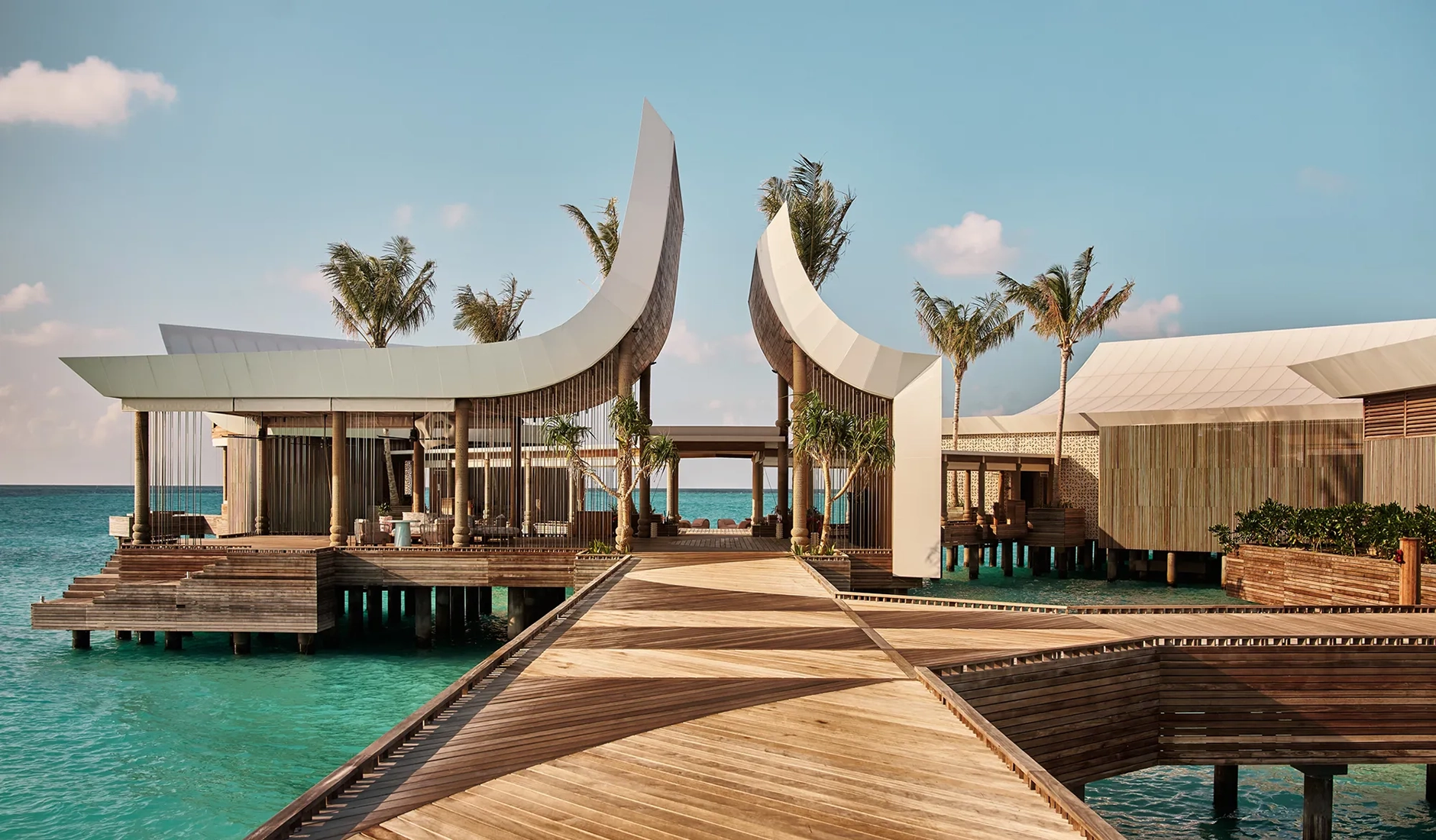 Private jetty at .Here Baa Atoll extending into the turquoise lagoon