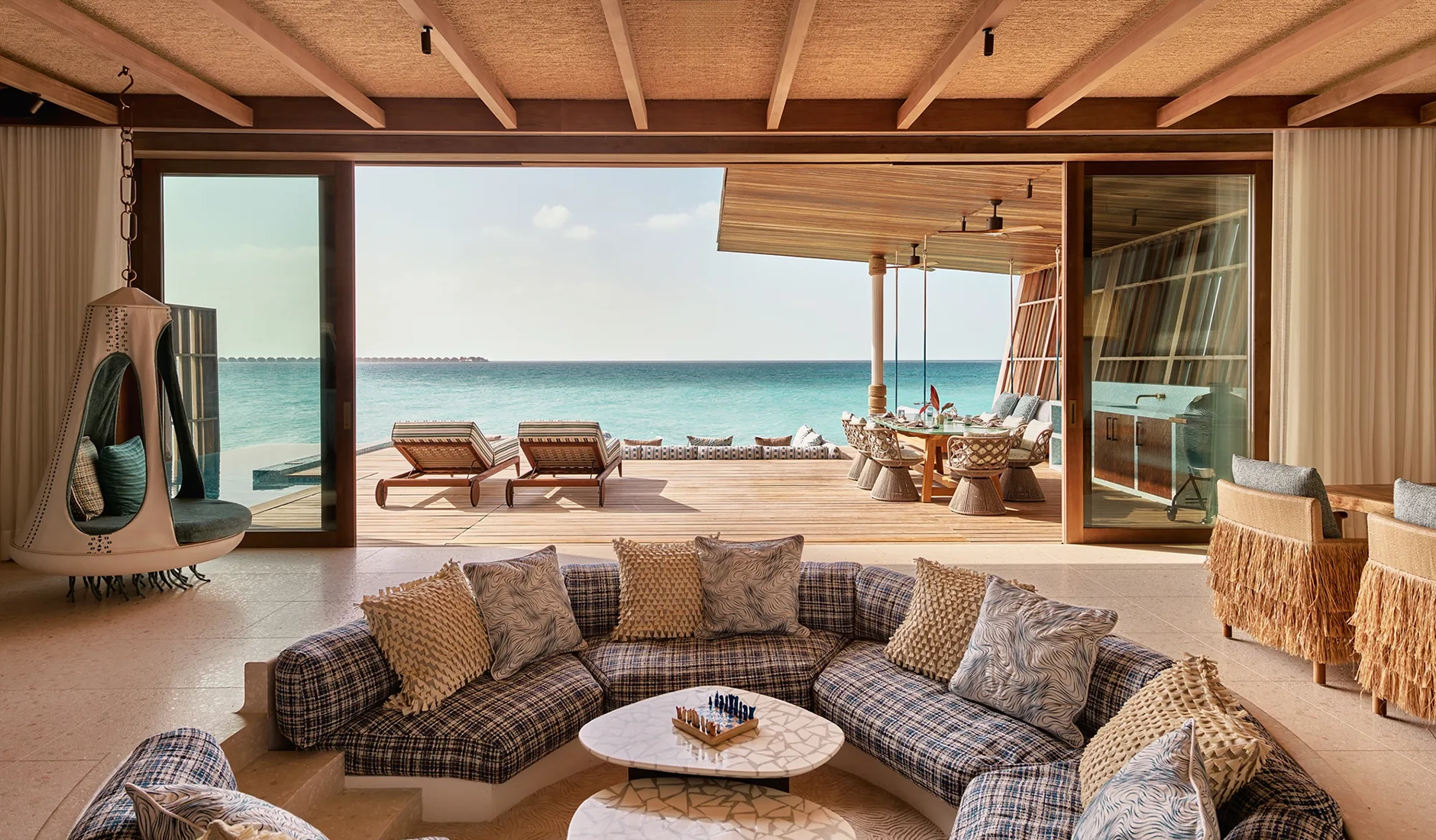 Open-plan living and dining area inside a private residence at .Here Baa Atoll