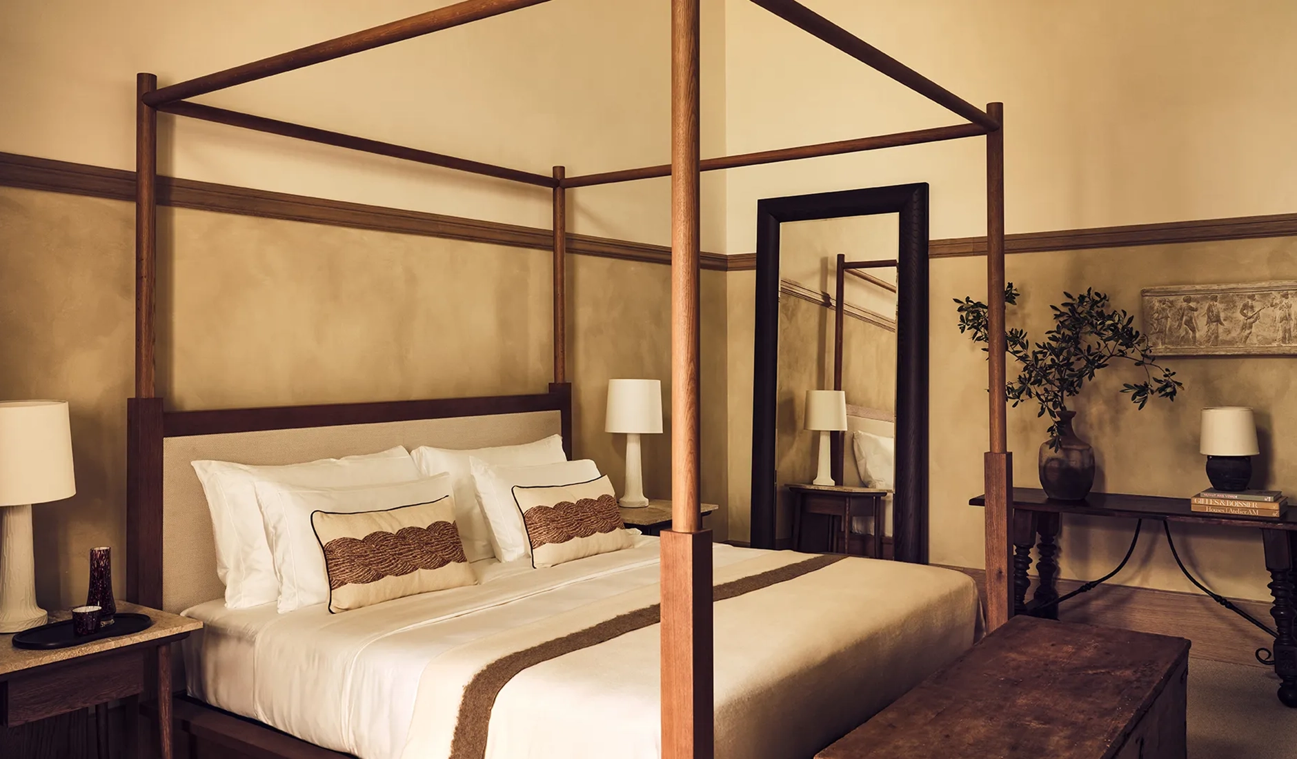 Master bedroom in a private residence at La Réserve Firenze with antique furnishings and original architectural details