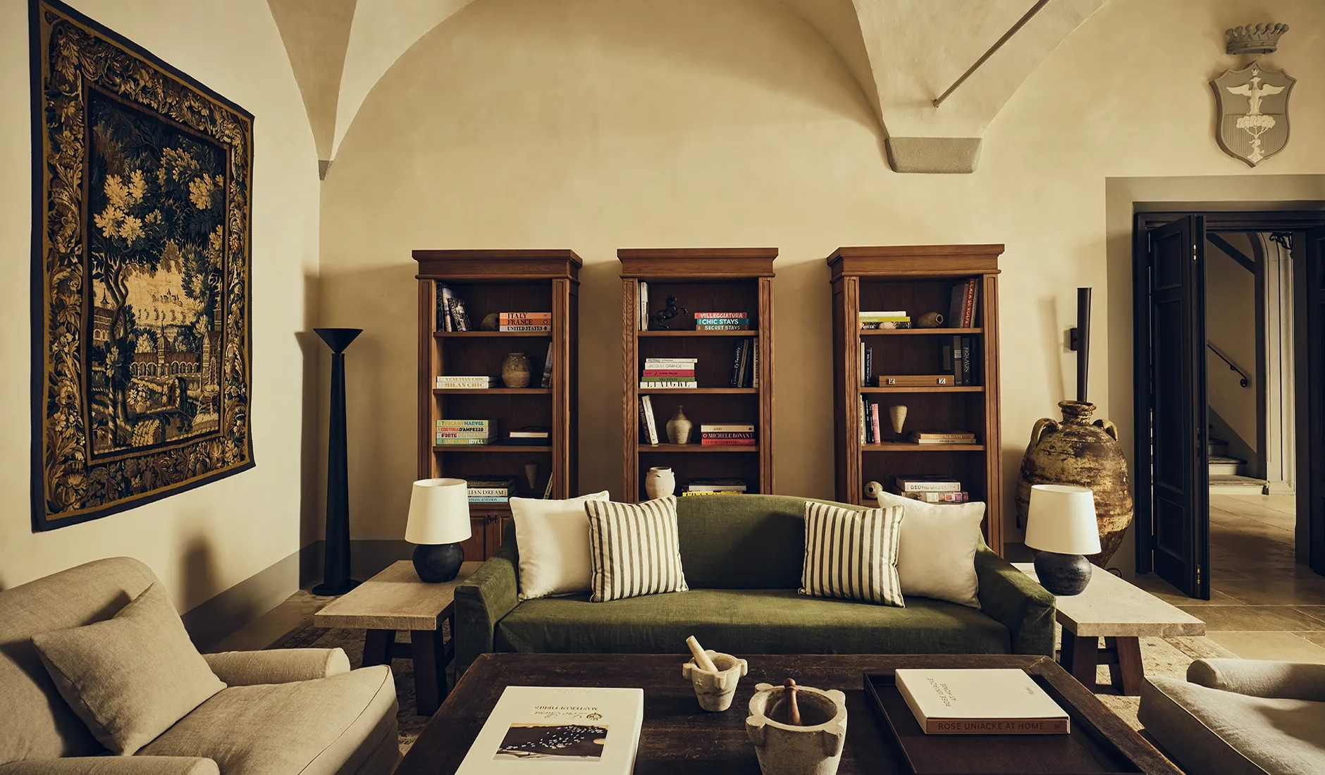 Private library at La Réserve Firenze with historic architectural features and curated furnishings