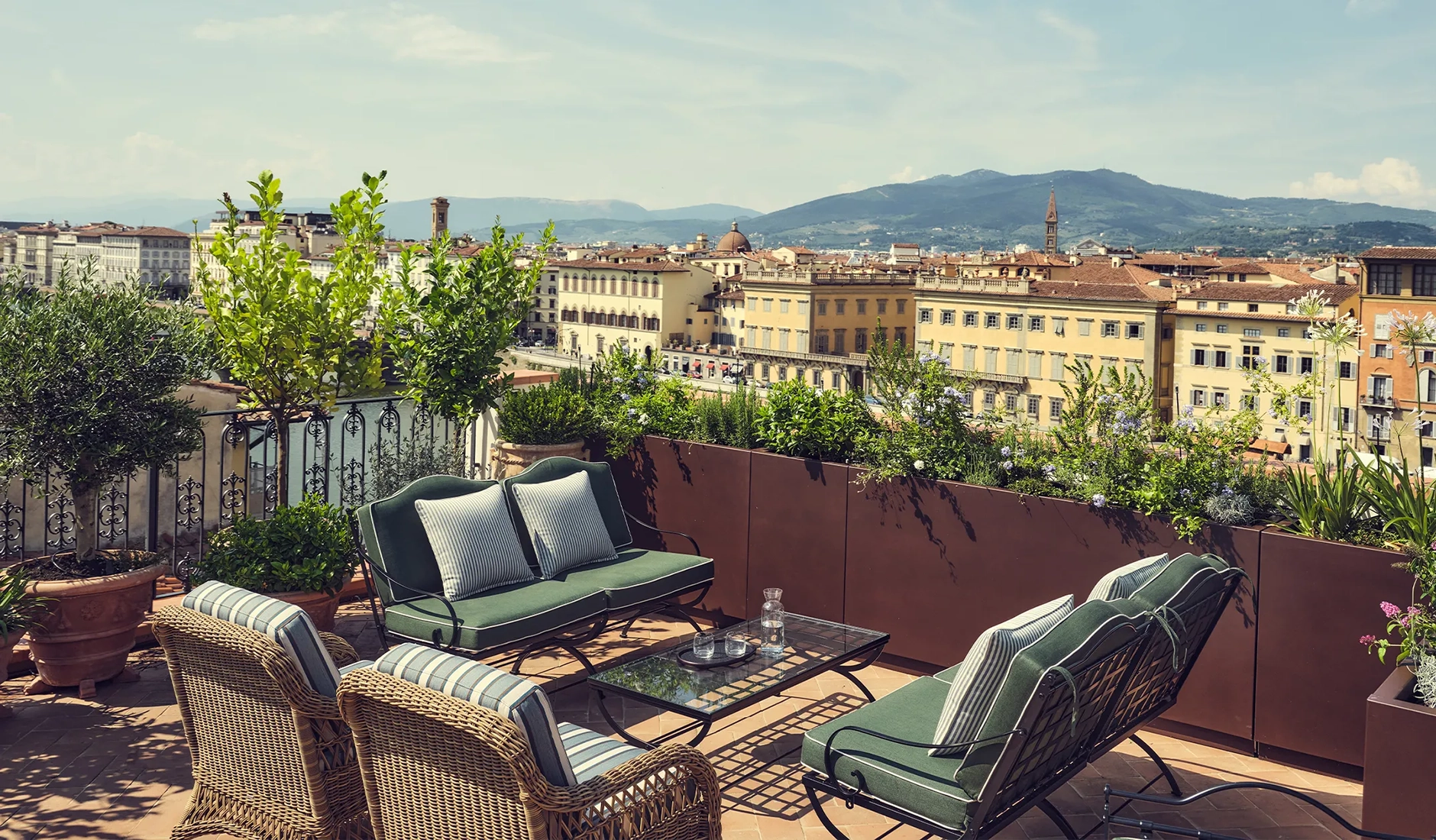 Rooftop terrace at La Réserve Firenze overlooking the historic rooftops of Florence