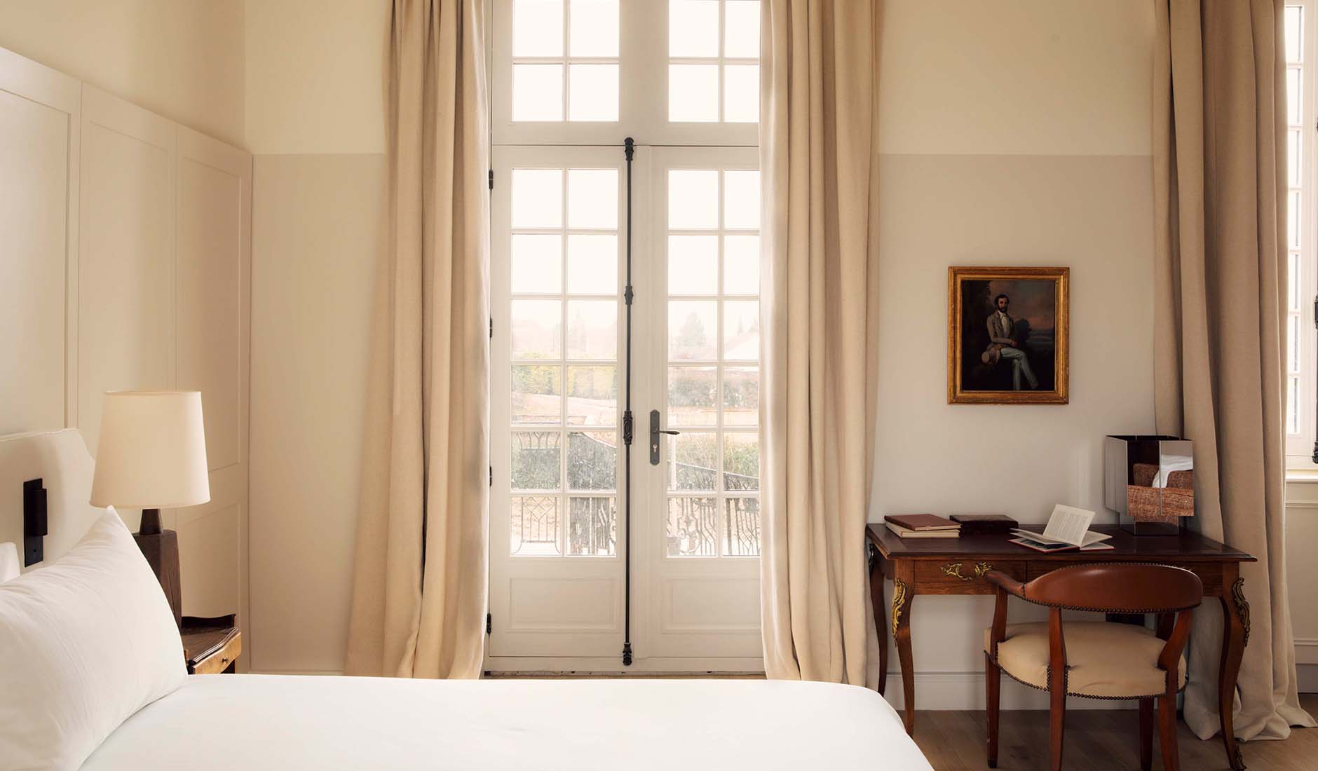 Bedroom at Les Sources de Vougeot featuring warm wood tones and natural materials