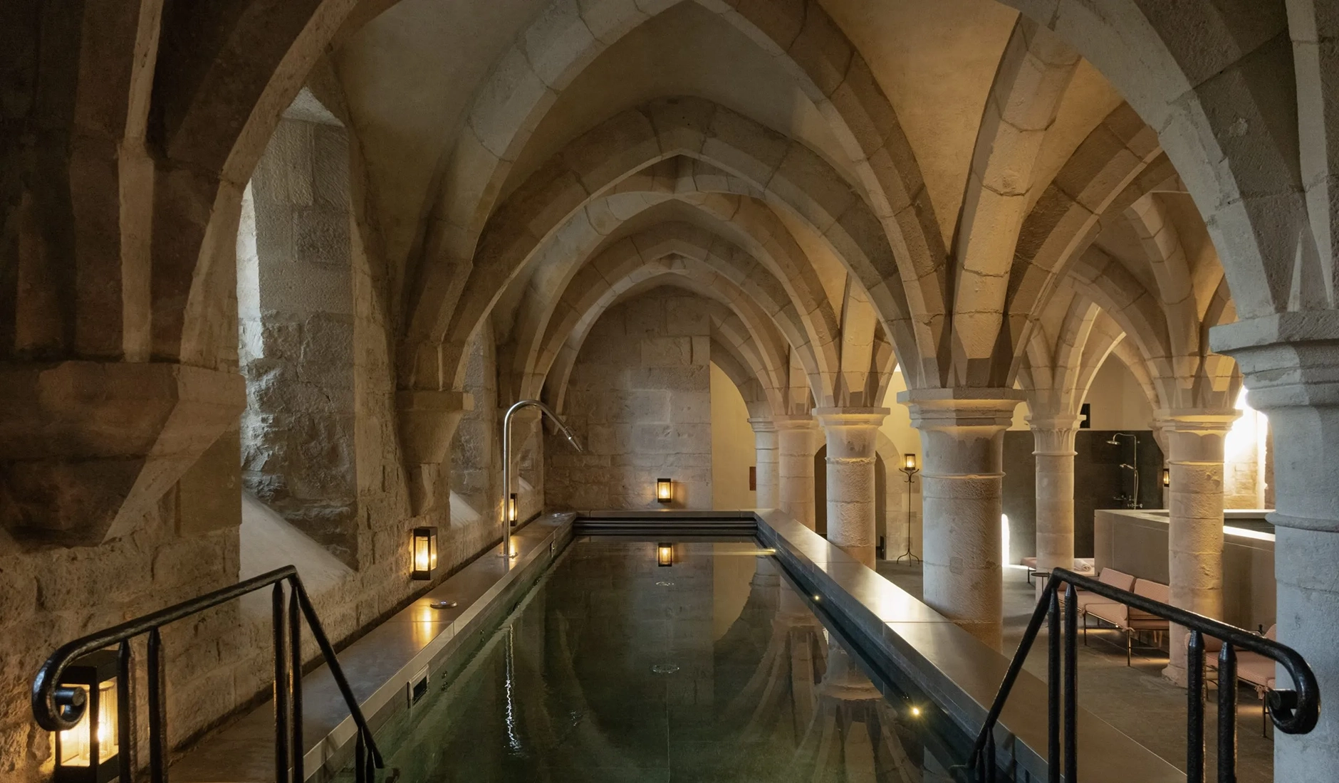 Indoor swimming pool beneath the historic vaulted ceilings of Spa Caudalie