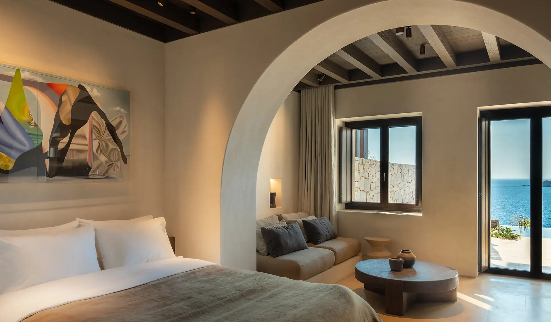 Luxury suite at Luura Cliff featuring understated interiors inspired by Cycladic design